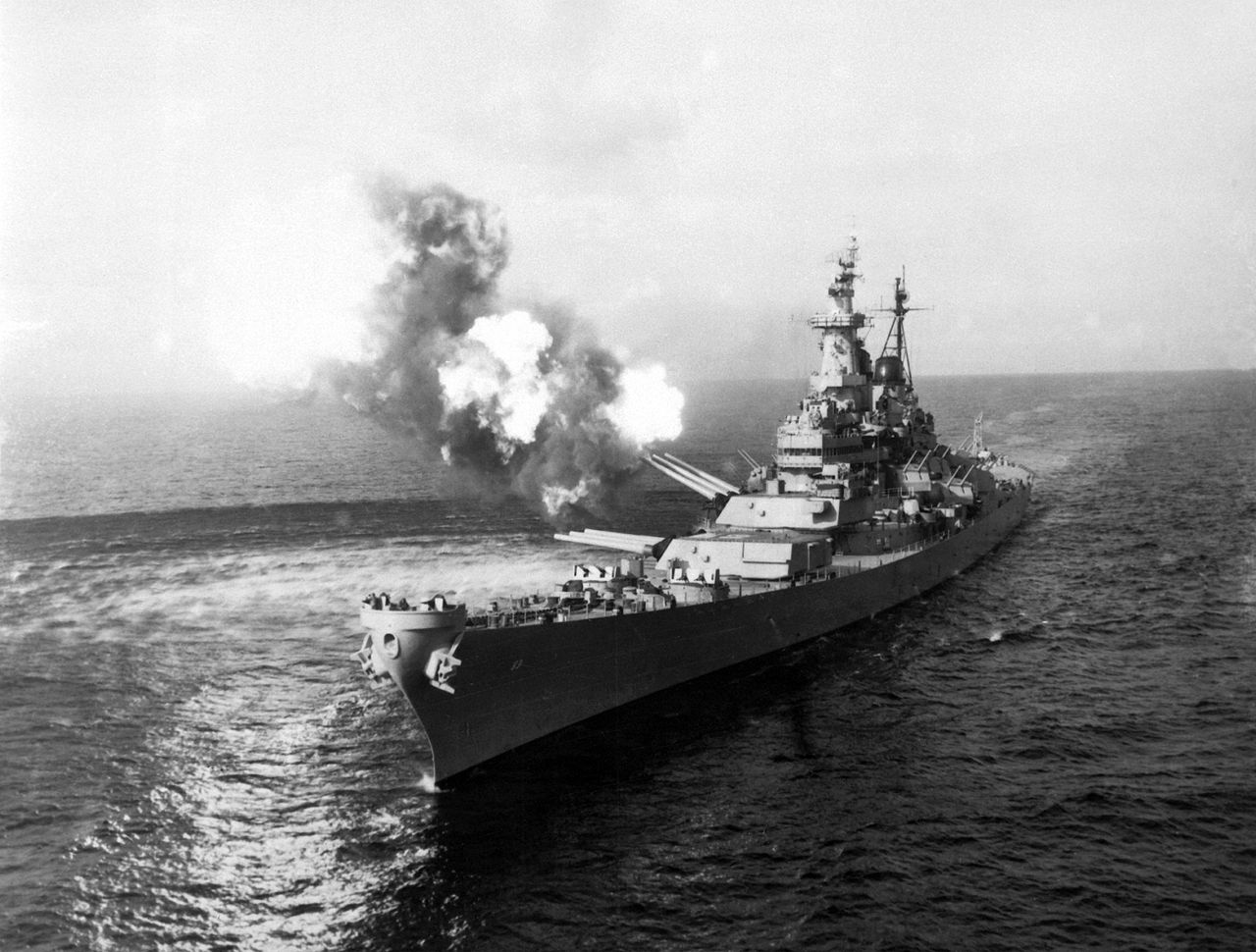To disrupt North Korean communications, USS Missouri fires a salvo from its 16-inch guns at shore targets near Chongjin, North Korea, 21 October 1950